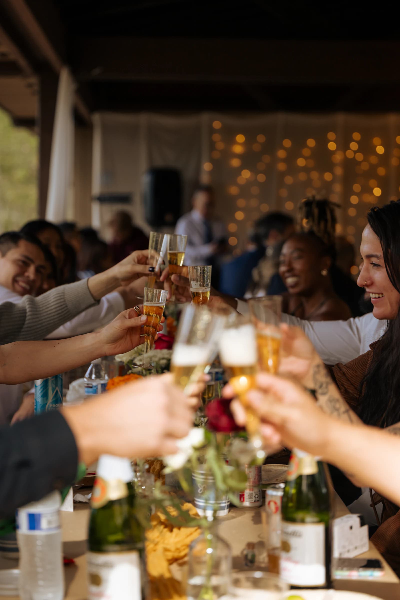 Friends raising glasses around a celebration table